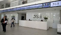 People walk near the reception at the Johannesburg Stock Exchange (JSE) in Sandton