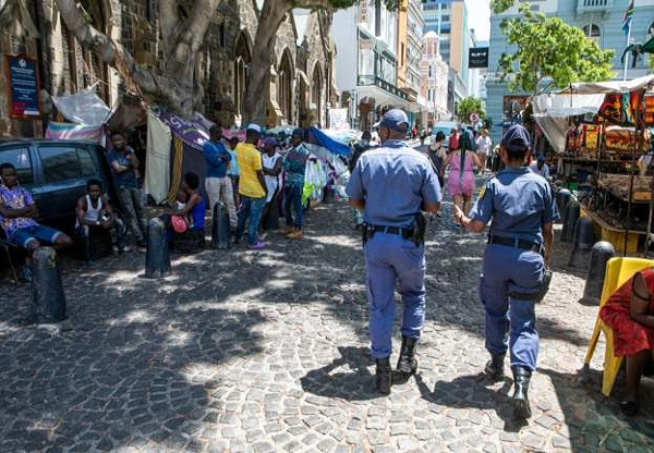 Souvenir businesses near the Methodist church in Cape Town want the group removed citing obstruction