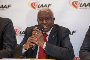 Lamine+Diack+in+front+of+IAAF+logo